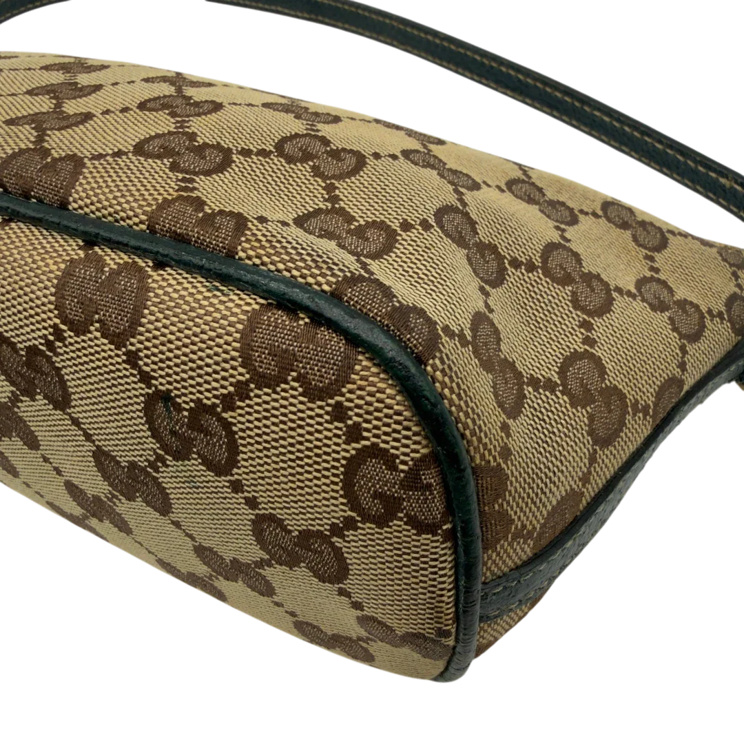 https://cdn.shopify.com/s/files/1/0564/9376/8855/files/Gucci_Handtasche_Boat_Baguette_monogram_beige_vintage_GG7305.webp?v=1778683624
