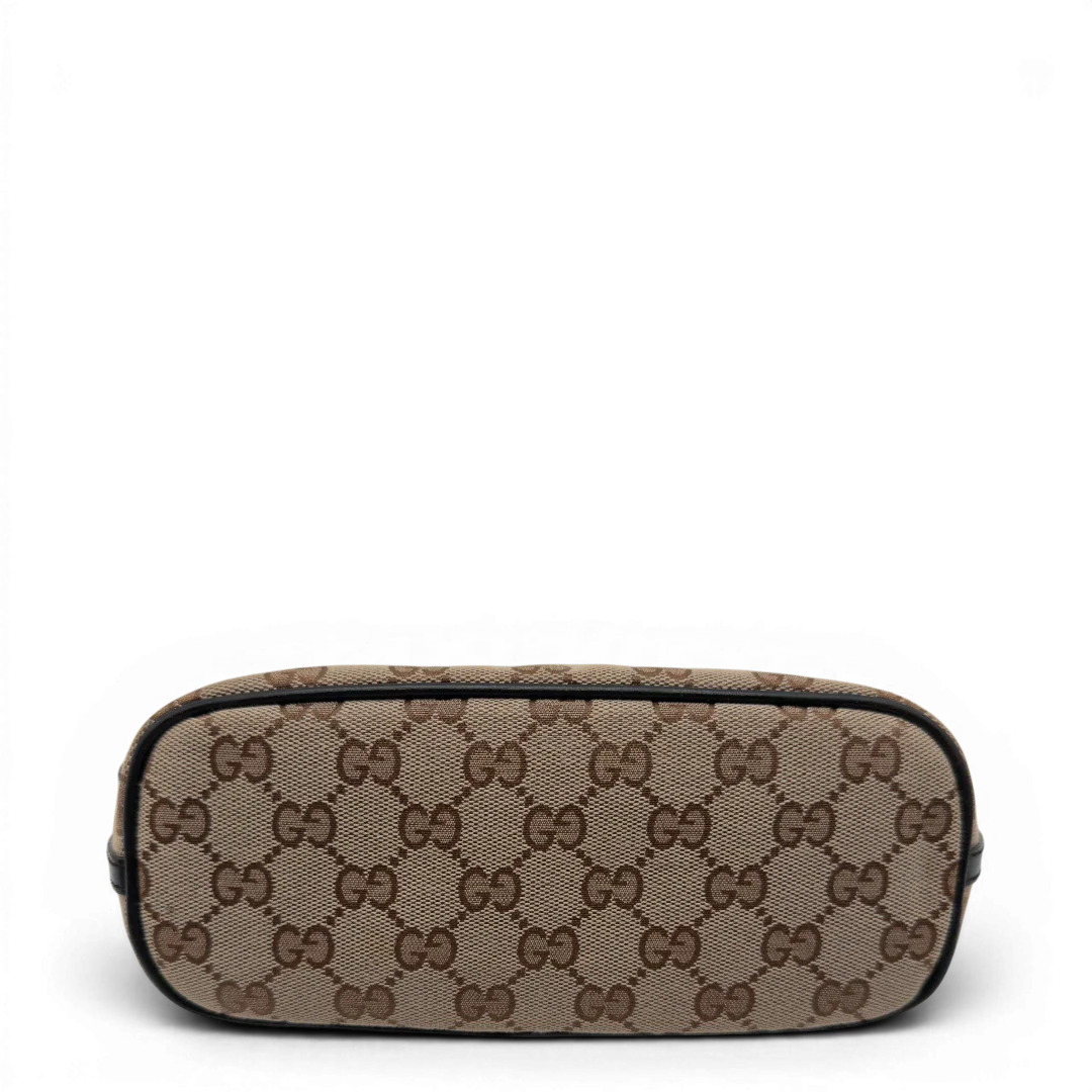 https://cdn.shopify.com/s/files/1/0564/9376/8855/files/Gucci_Handtasche_Boat_Baguette_monogram_beige_vintage_GG7589.webp?v=1779289596