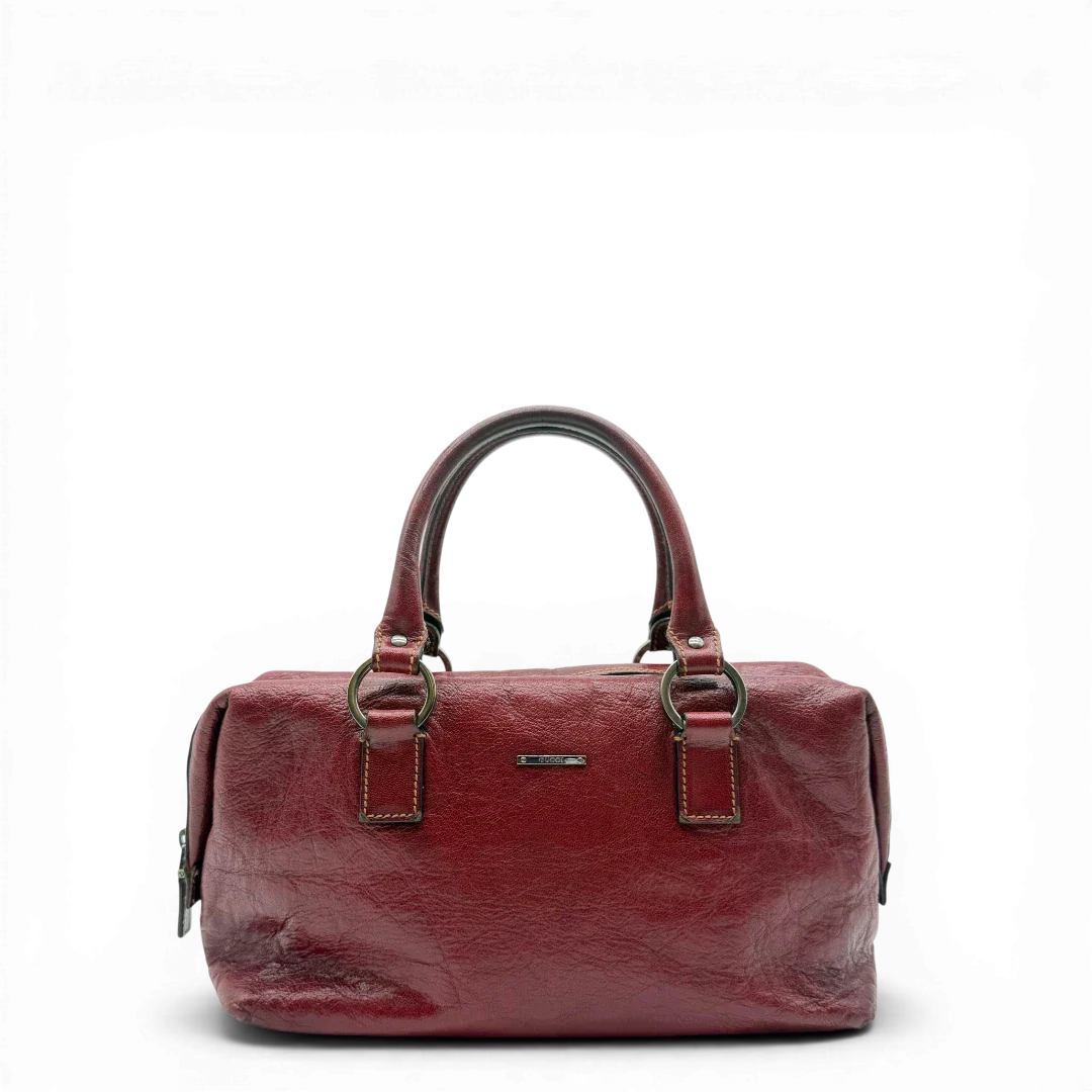 https://cdn.shopify.com/s/files/1/0564/9376/8855/files/Gucci_Handtasche_Boston_bag_aus_Leder_Rot_vintage_GG2890.webp?v=1774004038