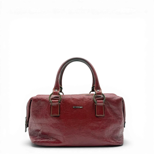 https://cdn.shopify.com/s/files/1/0564/9376/8855/files/Gucci_Handtasche_Boston_bag_aus_Leder_Rot_vintage_GG2890.webp?v=1774004038