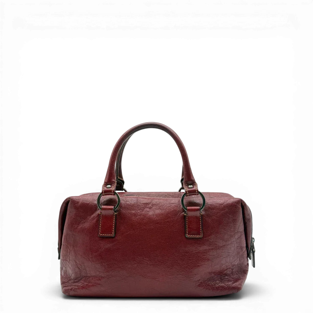 https://cdn.shopify.com/s/files/1/0564/9376/8855/files/Gucci_Handtasche_Boston_bag_aus_Leder_Rot_vintage_GG2891.webp?v=1774010468
