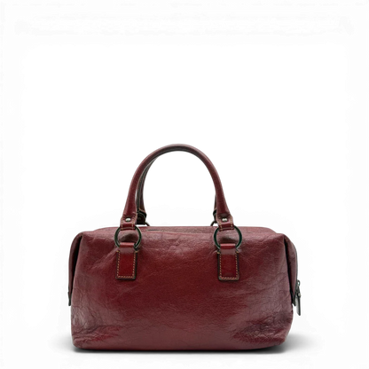 https://cdn.shopify.com/s/files/1/0564/9376/8855/files/Gucci_Handtasche_Boston_bag_aus_Leder_Rot_vintage_GG2891.webp?v=1774010468