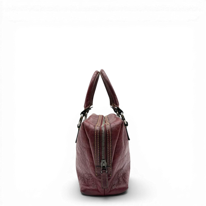 https://cdn.shopify.com/s/files/1/0564/9376/8855/files/Gucci_Handtasche_Boston_bag_aus_Leder_Rot_vintage_GG2896.webp?v=1774010468