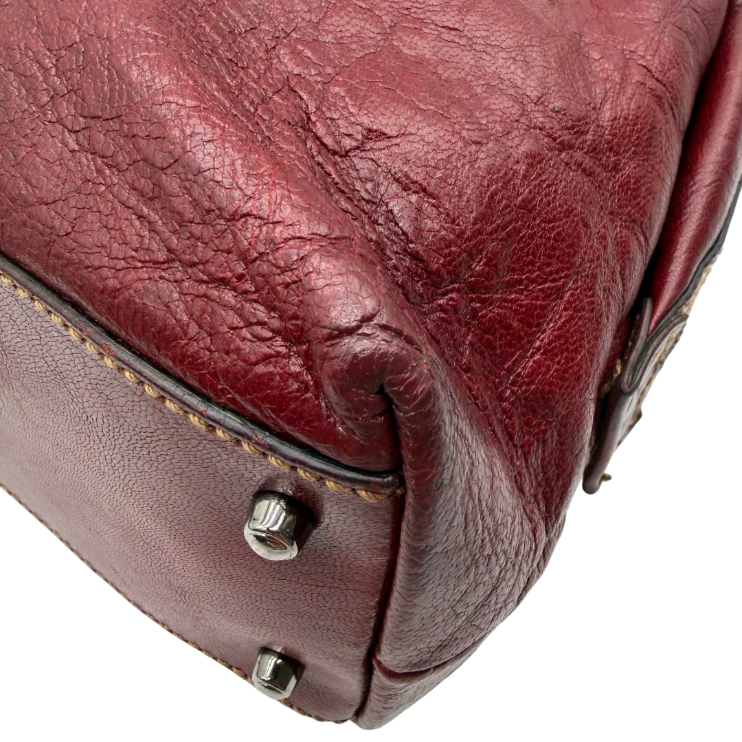 https://cdn.shopify.com/s/files/1/0564/9376/8855/files/Gucci_Handtasche_Boston_bag_aus_Leder_Rot_vintage_GG2899.webp?v=1774010468