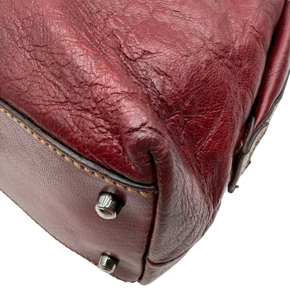 https://cdn.shopify.com/s/files/1/0564/9376/8855/files/Gucci_Handtasche_Boston_bag_aus_Leder_Rot_vintage_GG2899.webp?v=1774010468