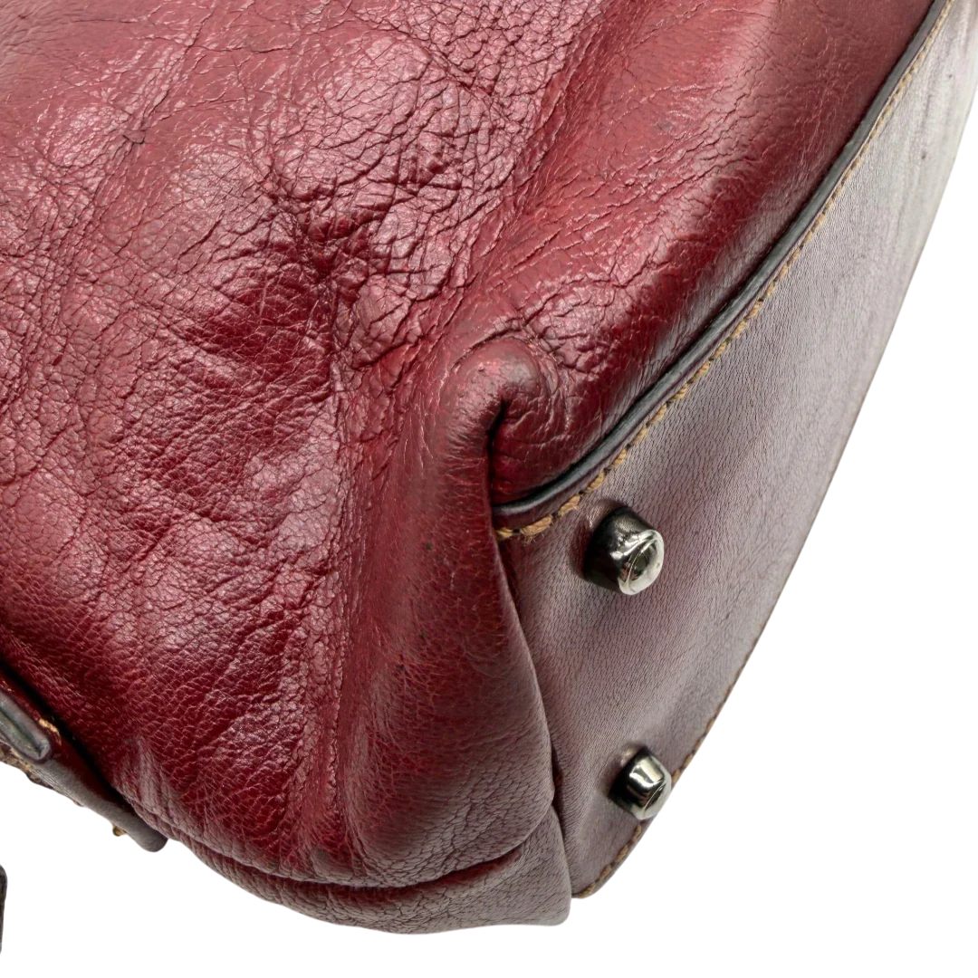 https://cdn.shopify.com/s/files/1/0564/9376/8855/files/Gucci_Handtasche_Boston_bag_aus_Leder_Rot_vintage_GG2900.webp?v=1774010468