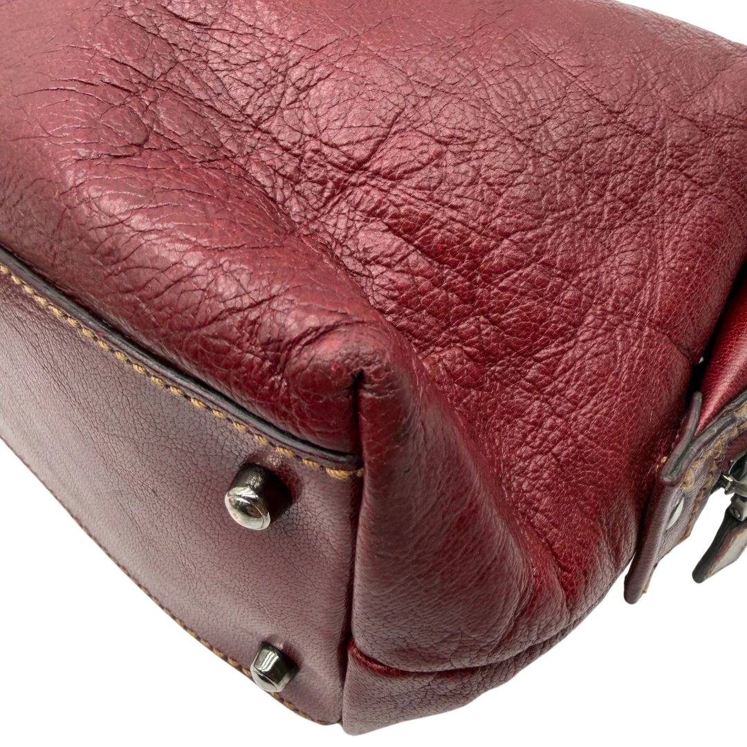 https://cdn.shopify.com/s/files/1/0564/9376/8855/files/Gucci_Handtasche_Boston_bag_aus_Leder_Rot_vintage_GG2901.webp?v=1774010468