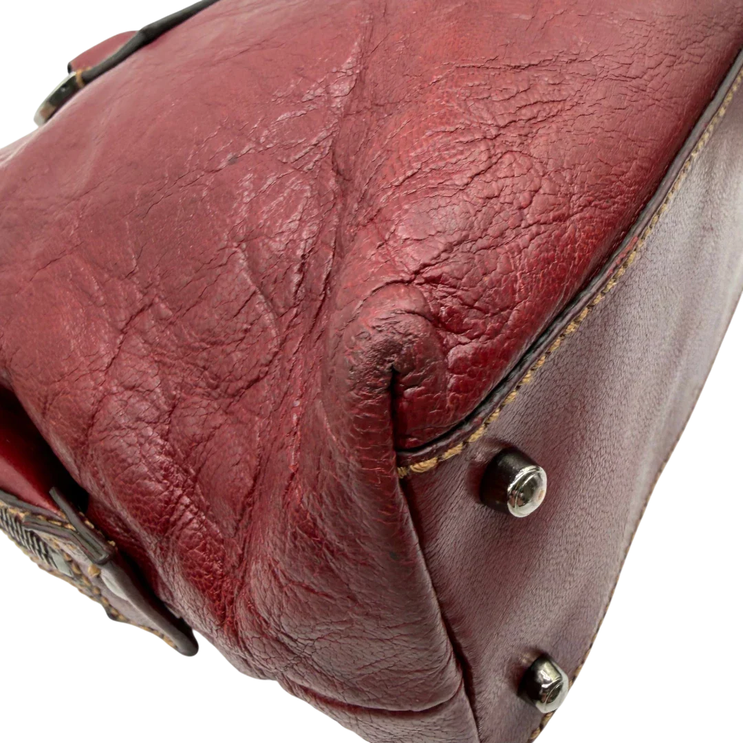 https://cdn.shopify.com/s/files/1/0564/9376/8855/files/Gucci_Handtasche_Boston_bag_aus_Leder_Rot_vintage_GG2902.webp?v=1774010468