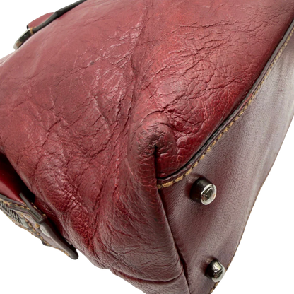 https://cdn.shopify.com/s/files/1/0564/9376/8855/files/Gucci_Handtasche_Boston_bag_aus_Leder_Rot_vintage_GG2902.webp?v=1774010468