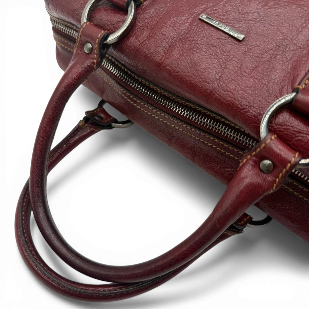 https://cdn.shopify.com/s/files/1/0564/9376/8855/files/Gucci_Handtasche_Boston_bag_aus_Leder_Rot_vintage_GG2903.webp?v=1774010468