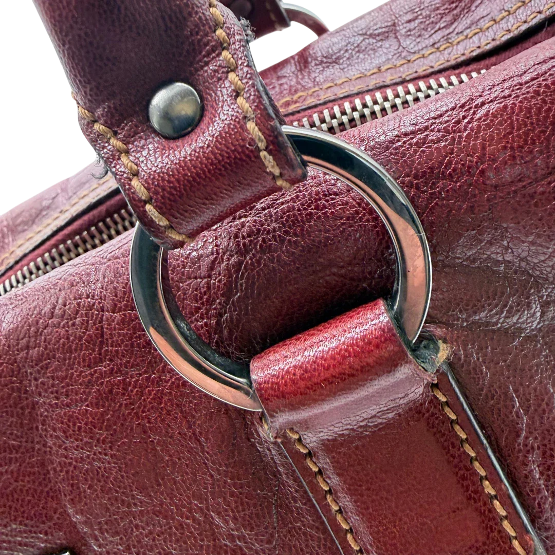 https://cdn.shopify.com/s/files/1/0564/9376/8855/files/Gucci_Handtasche_Boston_bag_aus_Leder_Rot_vintage_GG2905.webp?v=1774010468