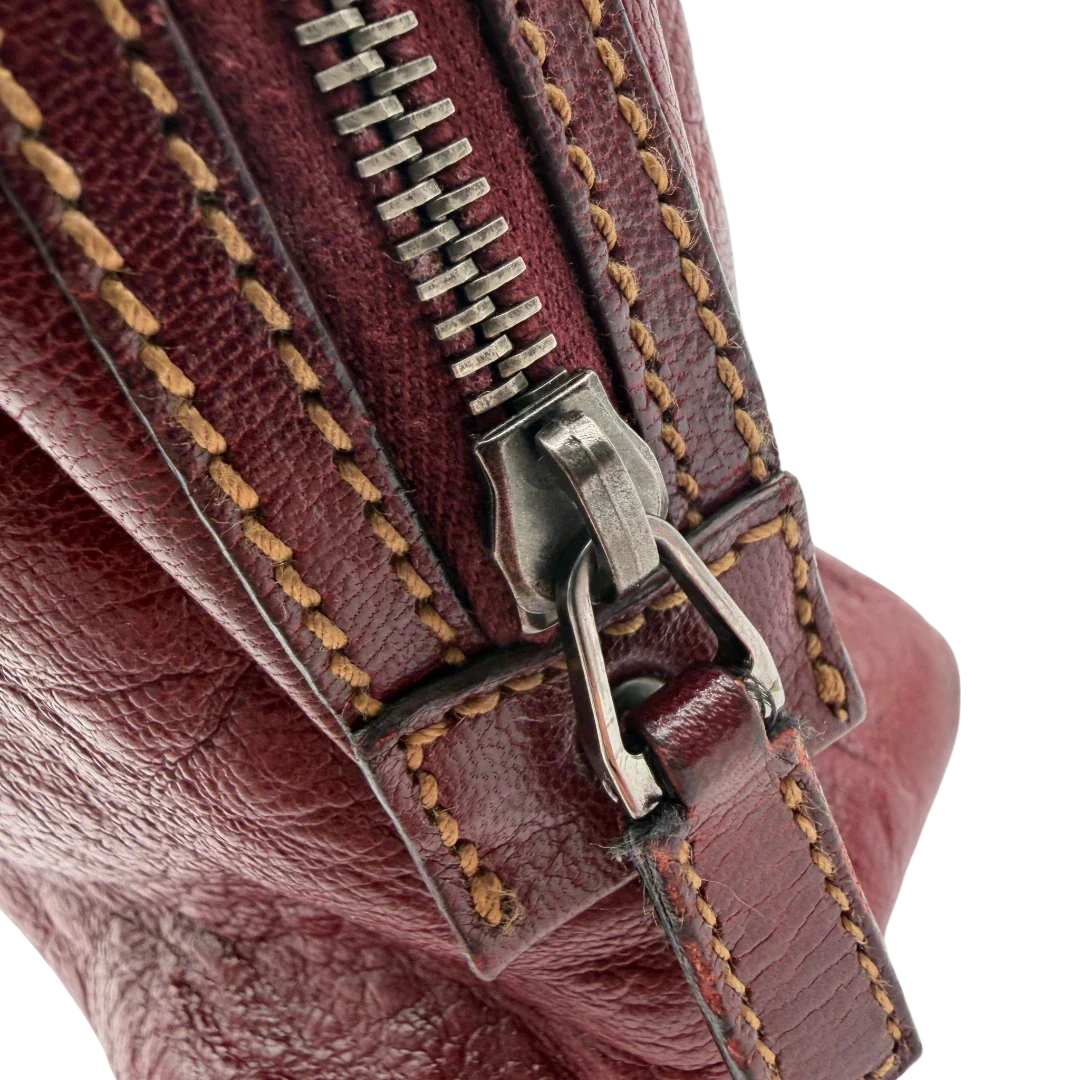 https://cdn.shopify.com/s/files/1/0564/9376/8855/files/Gucci_Handtasche_Boston_bag_aus_Leder_Rot_vintage_GG2906.webp?v=1774010468