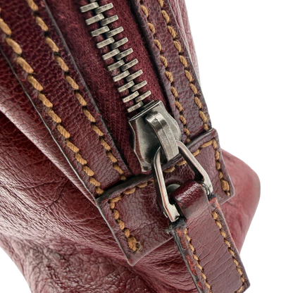 https://cdn.shopify.com/s/files/1/0564/9376/8855/files/Gucci_Handtasche_Boston_bag_aus_Leder_Rot_vintage_GG2906.webp?v=1774010468