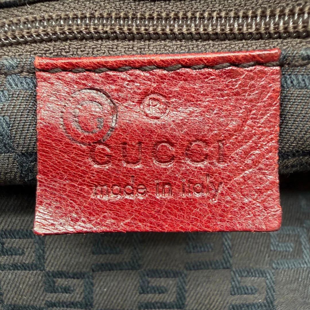 https://cdn.shopify.com/s/files/1/0564/9376/8855/files/Gucci_Handtasche_Boston_bag_aus_Leder_Rot_vintage_GG2908.webp?v=1774010468