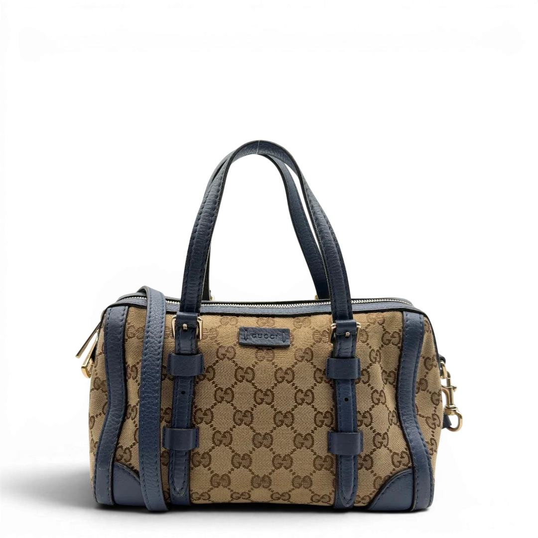https://cdn.shopify.com/s/files/1/0564/9376/8855/files/Gucci_Handtasche_Boston_mit_Umhangegurt_monogram_beige_vintage_GG8594.webp?v=1781107386