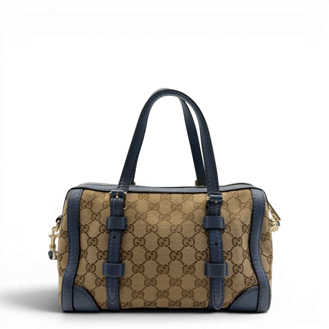 https://cdn.shopify.com/s/files/1/0564/9376/8855/files/Gucci_Handtasche_Boston_mit_Umhangegurt_monogram_beige_vintage_GG8595.webp?v=1781107385