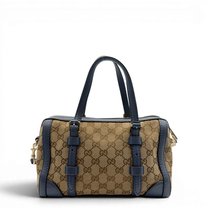 https://cdn.shopify.com/s/files/1/0564/9376/8855/files/Gucci_Handtasche_Boston_mit_Umhangegurt_monogram_beige_vintage_GG8595.webp?v=1781107385