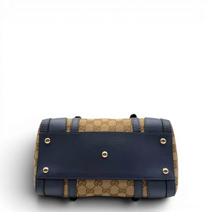 https://cdn.shopify.com/s/files/1/0564/9376/8855/files/Gucci_Handtasche_Boston_mit_Umhangegurt_monogram_beige_vintage_GG8598.webp?v=1781107385