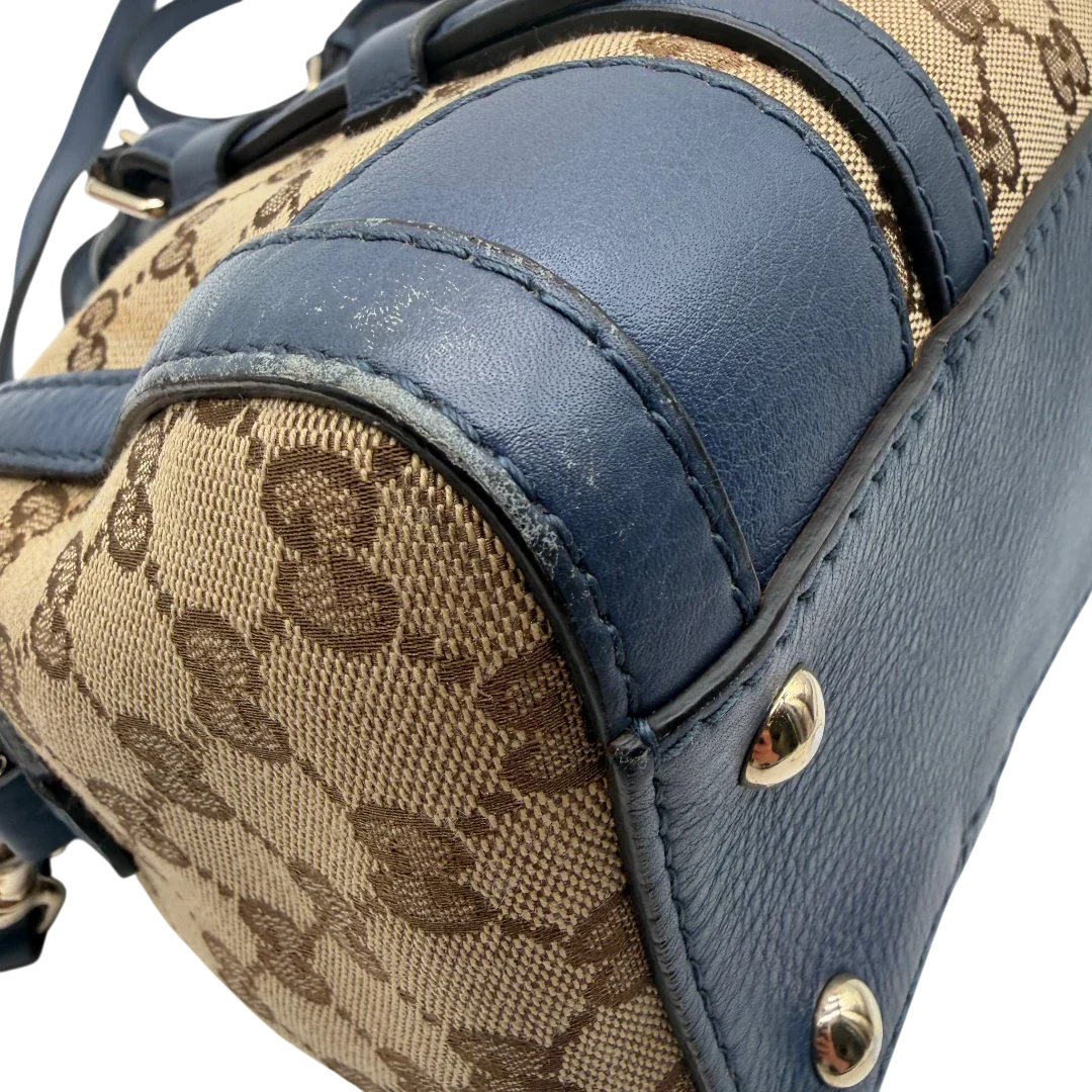 https://cdn.shopify.com/s/files/1/0564/9376/8855/files/Gucci_Handtasche_Boston_mit_Umhangegurt_monogram_beige_vintage_GG8600.webp?v=1781107385