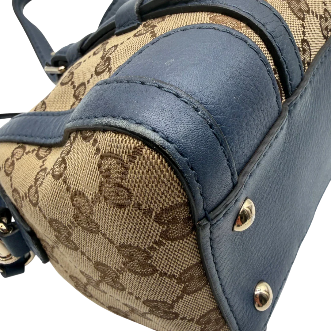 https://cdn.shopify.com/s/files/1/0564/9376/8855/files/Gucci_Handtasche_Boston_mit_Umhangegurt_monogram_beige_vintage_GG8602.webp?v=1781107385