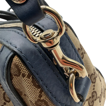 https://cdn.shopify.com/s/files/1/0564/9376/8855/files/Gucci_Handtasche_Boston_mit_Umhangegurt_monogram_beige_vintage_GG8606.webp?v=1781107385
