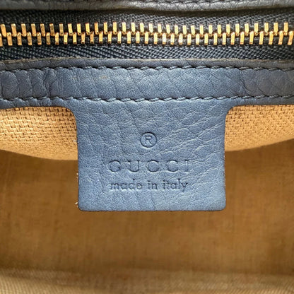 https://cdn.shopify.com/s/files/1/0564/9376/8855/files/Gucci_Handtasche_Boston_mit_Umhangegurt_monogram_beige_vintage_GG8608.webp?v=1781107385