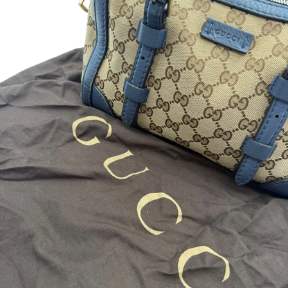 https://cdn.shopify.com/s/files/1/0564/9376/8855/files/Gucci_Handtasche_Boston_mit_Umhangegurt_monogram_beige_vintage_GG8612.webp?v=1781107386