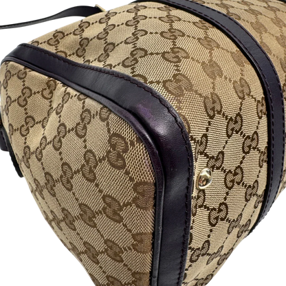 https://cdn.shopify.com/s/files/1/0564/9376/8855/files/Gucci_Handtasche_Boston_mit_Umhangegurt_monogram_beige_vintage_GG9942.webp?v=1775725815