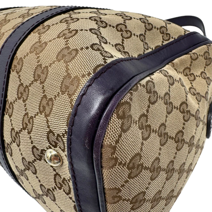 https://cdn.shopify.com/s/files/1/0564/9376/8855/files/Gucci_Handtasche_Boston_mit_Umhangegurt_monogram_beige_vintage_GG9945.webp?v=1775725815