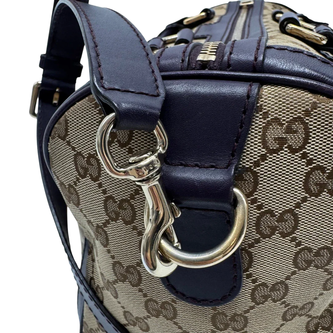 https://cdn.shopify.com/s/files/1/0564/9376/8855/files/Gucci_Handtasche_Boston_mit_Umhangegurt_monogram_beige_vintage_GG9950.webp?v=1775725815