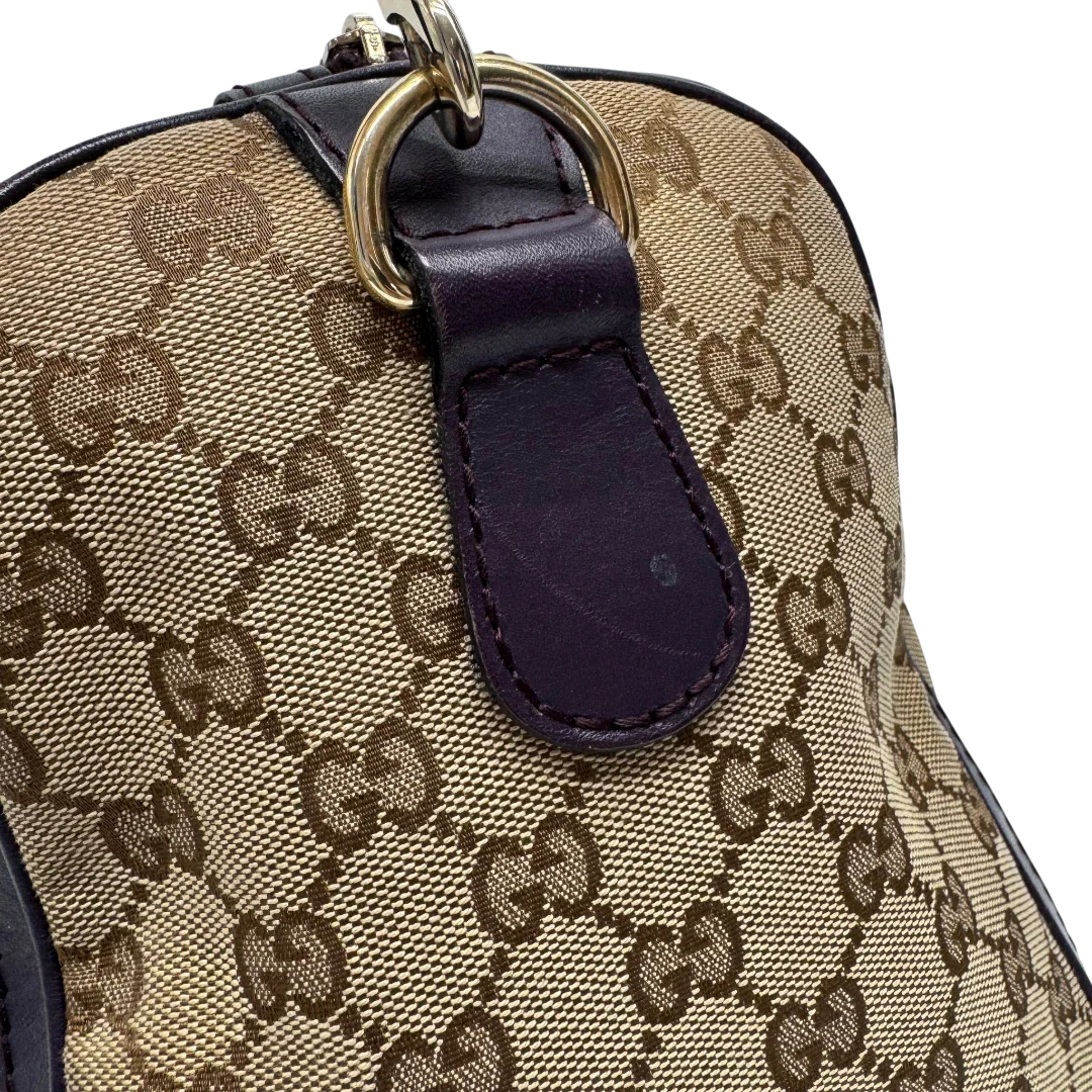 https://cdn.shopify.com/s/files/1/0564/9376/8855/files/Gucci_Handtasche_Boston_mit_Umhangegurt_monogram_beige_vintage_GG9954.webp?v=1775725815