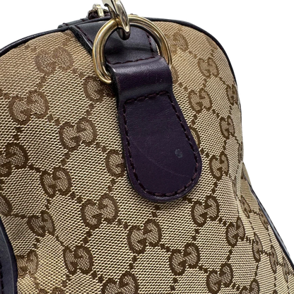 https://cdn.shopify.com/s/files/1/0564/9376/8855/files/Gucci_Handtasche_Boston_mit_Umhangegurt_monogram_beige_vintage_GG9954.webp?v=1775725815