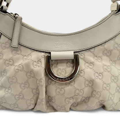 https://cdn.shopify.com/s/files/1/0564/9376/8855/files/Gucci_Handtasche_D-Ring_aus_Leder_monogram_creme___beige_vintage_GG_handbag_5278.webp?v=1765385915