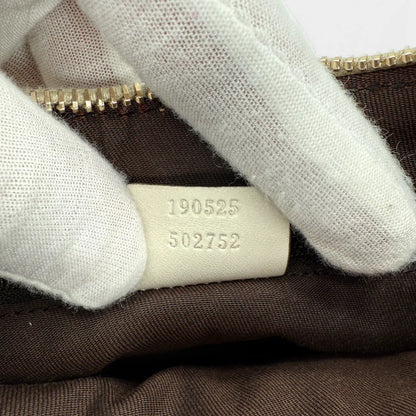 https://cdn.shopify.com/s/files/1/0564/9376/8855/files/Gucci_Handtasche_D-Ring_aus_Leder_monogram_creme___beige_vintage_GG_handbag_5281.webp?v=1765385915