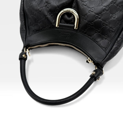 https://cdn.shopify.com/s/files/1/0564/9376/8855/files/Gucci_Handtasche_D-Ring_aus_Leder_monogram_schwarz_vintage_GG_handbag_5260.webp?v=1765382291