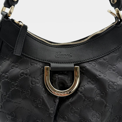 https://cdn.shopify.com/s/files/1/0564/9376/8855/files/Gucci_Handtasche_D-Ring_aus_Leder_monogram_schwarz_vintage_GG_handbag_5261.webp?v=1765382291