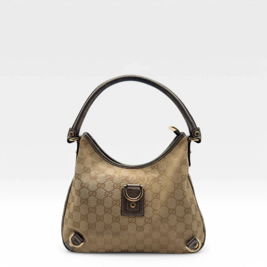 https://cdn.shopify.com/s/files/1/0564/9376/8855/files/Gucci_Handtasche_D-Ring_khaki_Lederdetails_monogram_beige_second_hand_luxury_GG_handbag_8404.webp?v=1741950473