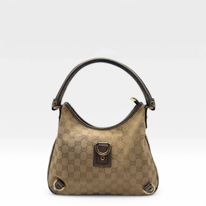 https://cdn.shopify.com/s/files/1/0564/9376/8855/files/Gucci_Handtasche_D-Ring_khaki_Lederdetails_monogram_beige_second_hand_luxury_GG_handbag_8404.webp?v=1741950473