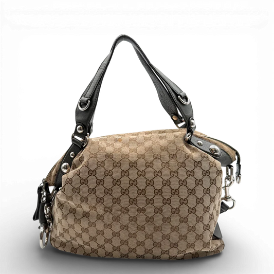 https://cdn.shopify.com/s/files/1/0564/9376/8855/files/Gucci_Handtasche_Horsebit_mit_Umhangegurt_monogram_beige_vintage_GG00001.webp?v=1772756315