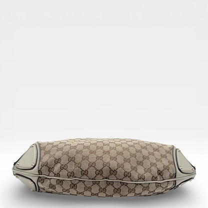 https://cdn.shopify.com/s/files/1/0564/9376/8855/files/Gucci_Handtasche_Indy_mit_Umhaengegurt_monogram_beige_vintage_GG_8645.webp?v=1768480310