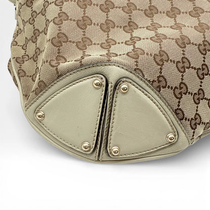 https://cdn.shopify.com/s/files/1/0564/9376/8855/files/Gucci_Handtasche_Indy_mit_Umhaengegurt_monogram_beige_vintage_GG_8647.webp?v=1768480310