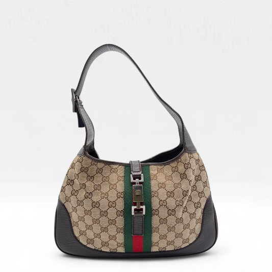 https://cdn.shopify.com/s/files/1/0564/9376/8855/files/Gucci_Handtasche_Jackie_Sherry_Line_monogram_beige_second_hand_luxury_GG_handbag0877.webp?v=1752143385