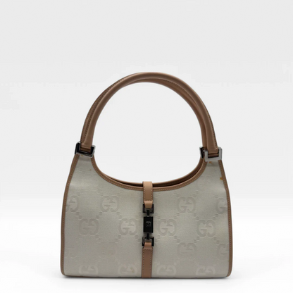 https://cdn.shopify.com/s/files/1/0564/9376/8855/files/Gucci_Handtasche_Jackie_mit_hellbraunen_Leder_monogram_weiss_vintage_designer_GG_handbag_8292.webp?v=1741969074