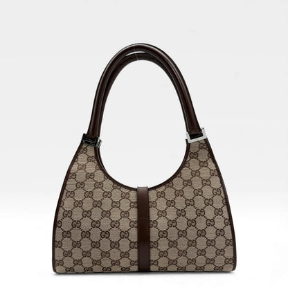 https://cdn.shopify.com/s/files/1/0564/9376/8855/files/Gucci_Handtasche_Jackie_monogram_beige_vintage_GG_handbag_5305.webp?v=1765384622