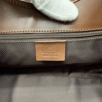 https://cdn.shopify.com/s/files/1/0564/9376/8855/files/Gucci_Handtasche_Jackie_monogram_beige_vintage_GG_handbag_5317.webp?v=1765384622