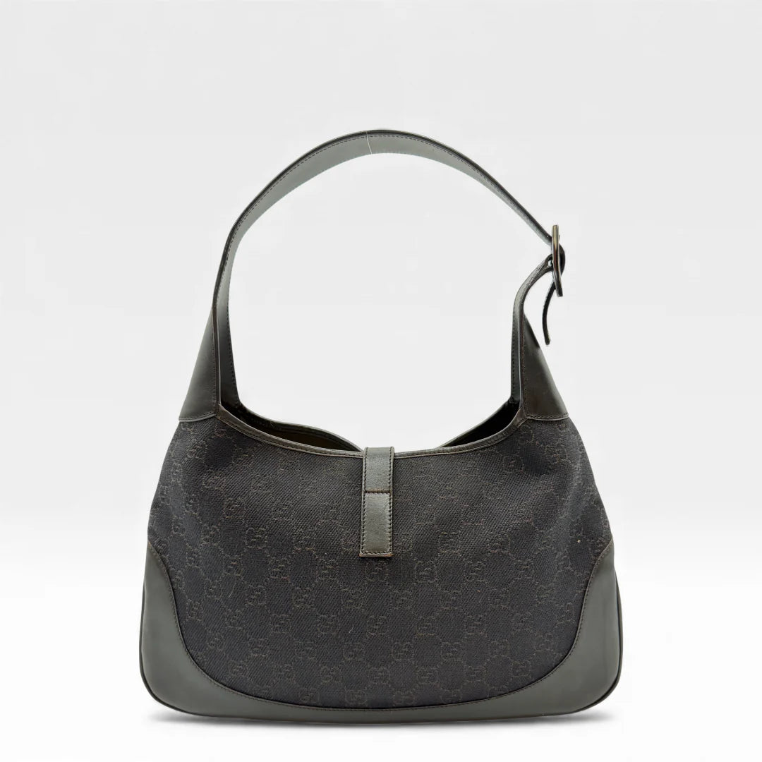 https://cdn.shopify.com/s/files/1/0564/9376/8855/files/Gucci_Handtasche_Jackie_monogram_dunkelbraun_vintage_GG_handbag_4428.webp?v=1765401160
