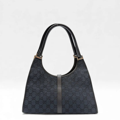 https://cdn.shopify.com/s/files/1/0564/9376/8855/files/Gucci_Handtasche_Jackie_monogram_schwarz_vintage_GG_handbag_4352.webp?v=1765387051