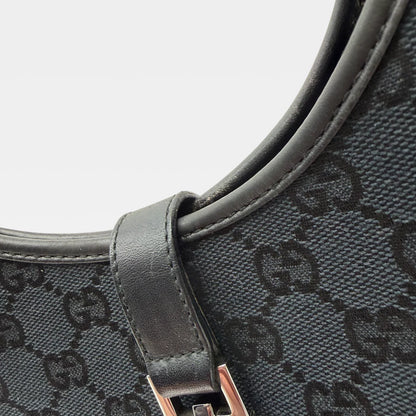 https://cdn.shopify.com/s/files/1/0564/9376/8855/files/Gucci_Handtasche_Jackie_monogram_schwarz_vintage_GG_handbag_4368.webp?v=1765387051