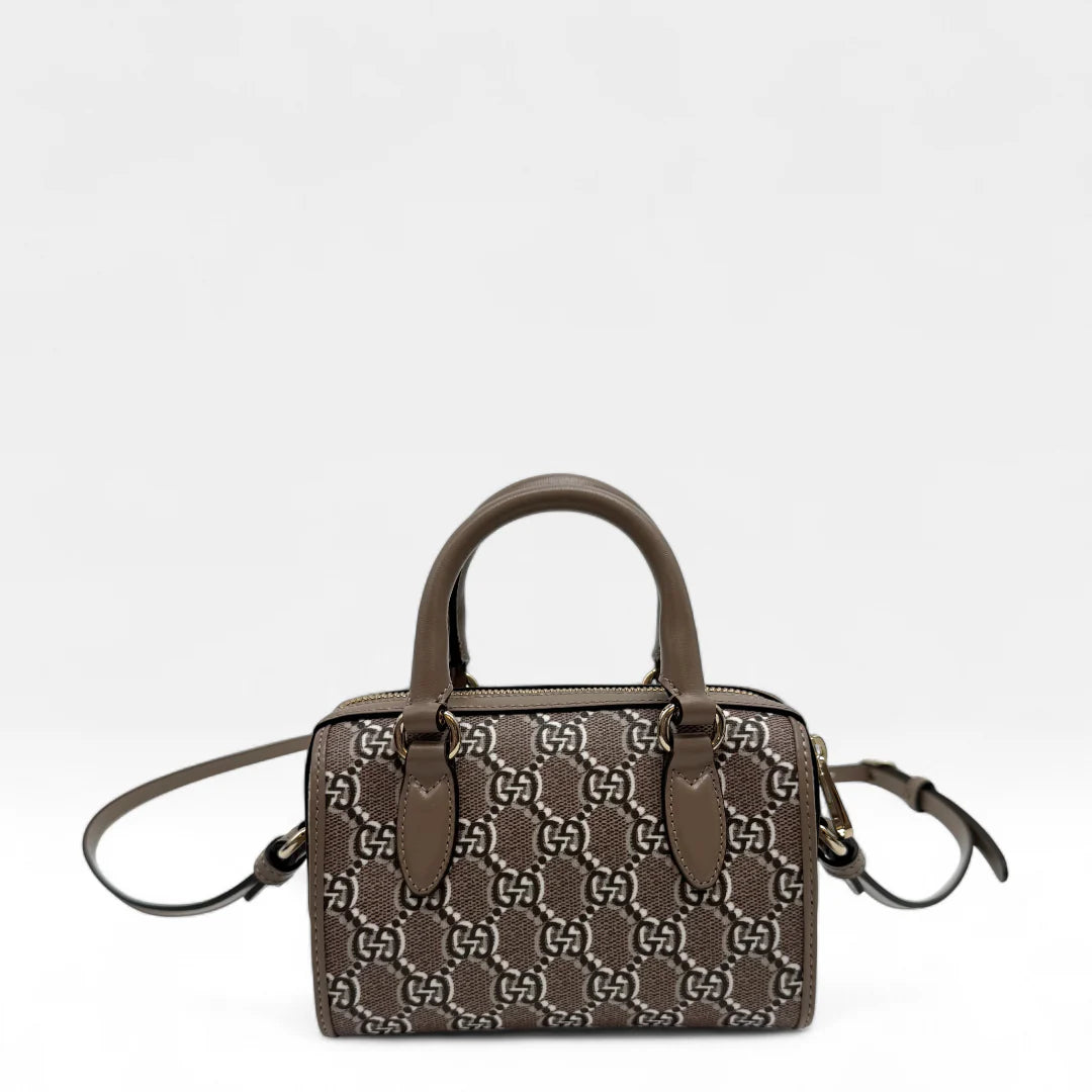 https://cdn.shopify.com/s/files/1/0564/9376/8855/files/Gucci_Handtasche_Joy_mini_monogram_hellbraun_handbag5193.webp?v=1761264419