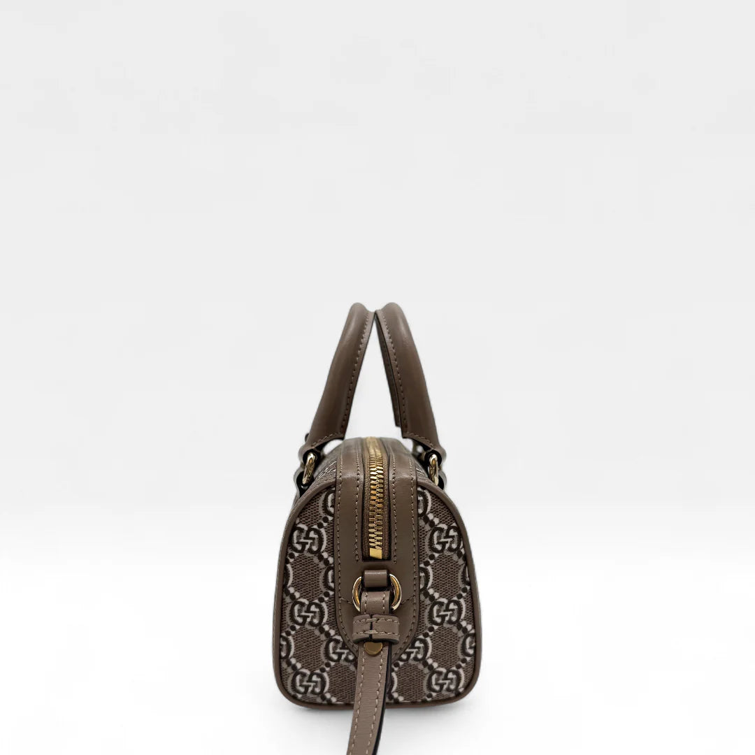 https://cdn.shopify.com/s/files/1/0564/9376/8855/files/Gucci_Handtasche_Joy_mini_monogram_hellbraun_handbag5194.webp?v=1761264419